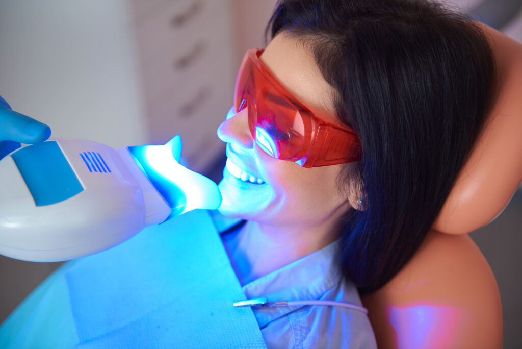 Happy woman with eyes closed in dentist chair